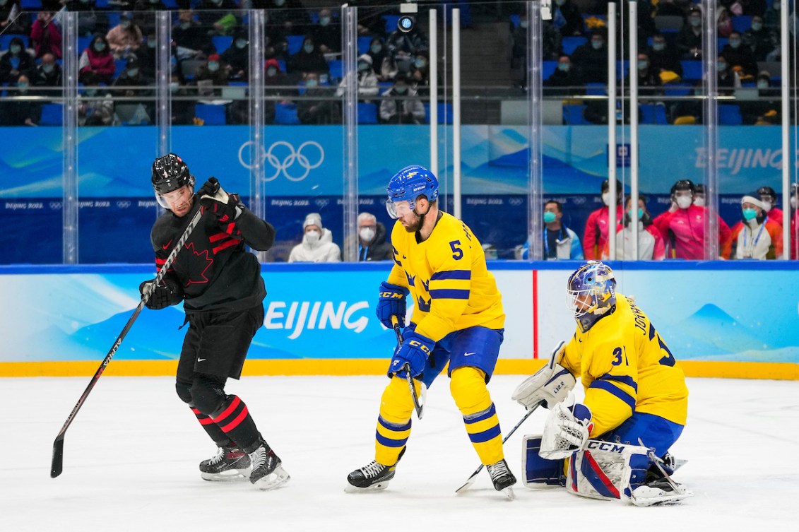 Corban Knight #9 of Team Canada battles against Oscar Fantenberg #5 of Team Sweden