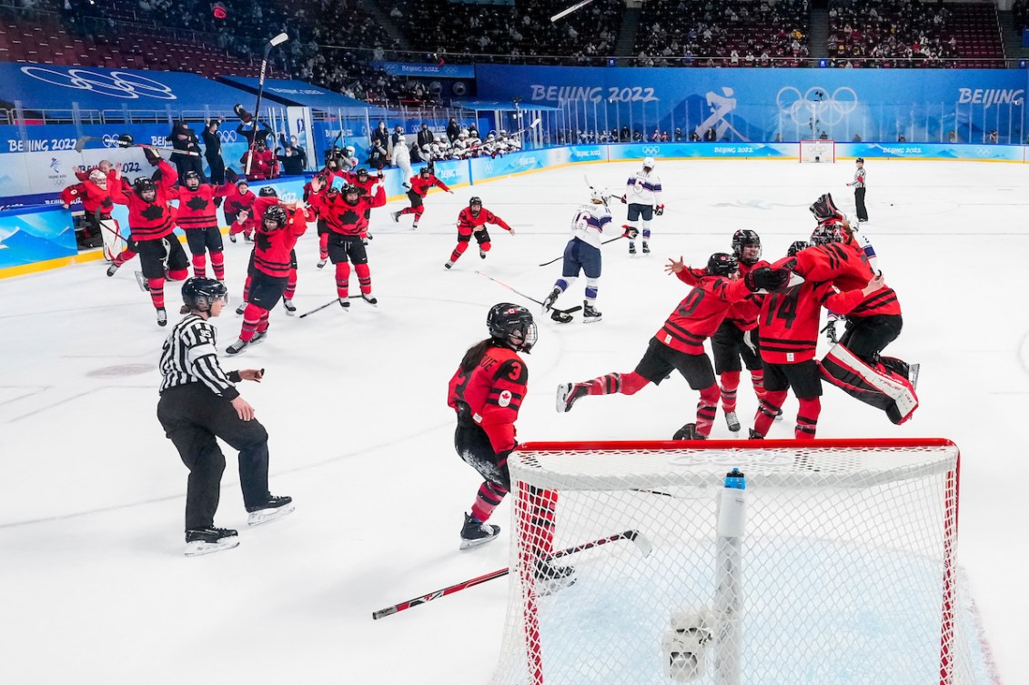 Team Canada celebrates winning the gold medal women's hockey game