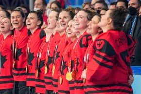 Team Canada celebrates winning the gold medal women's hockey game