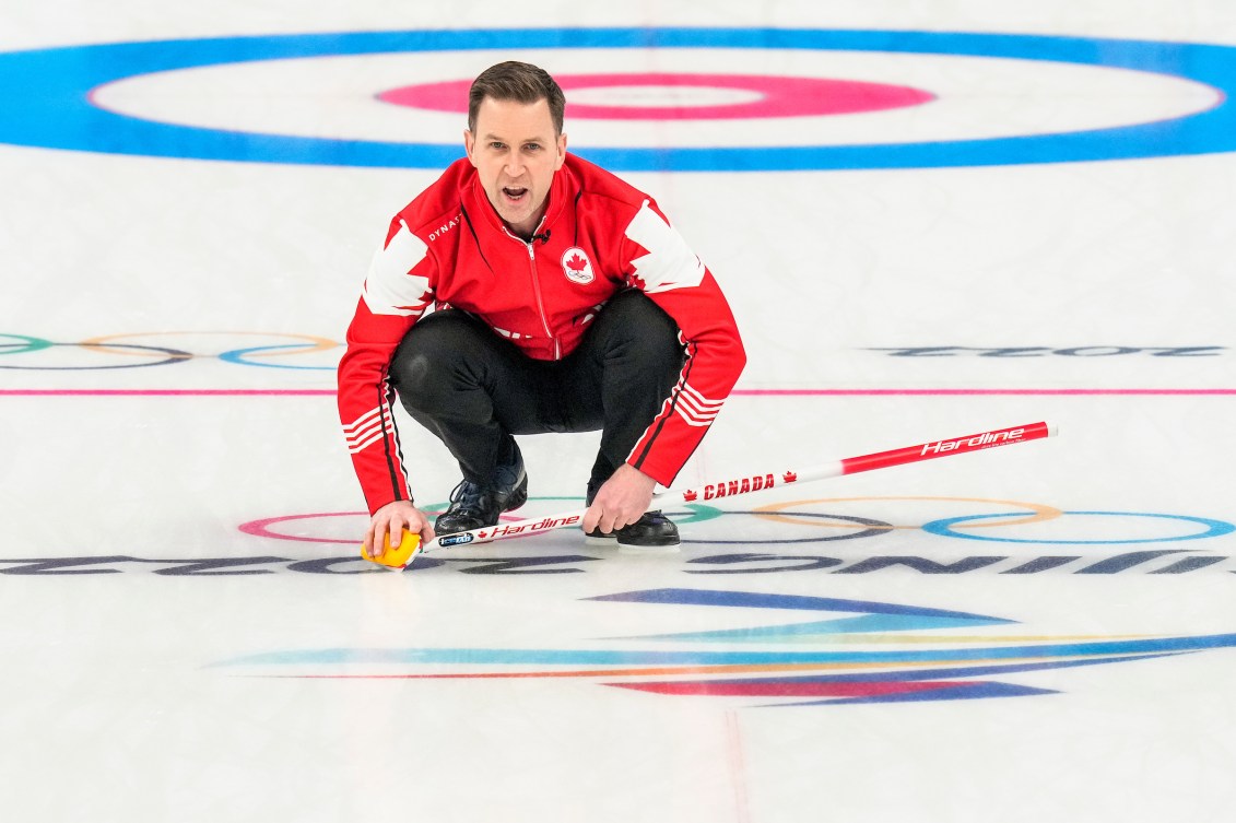 Brad Gushue watches his stone