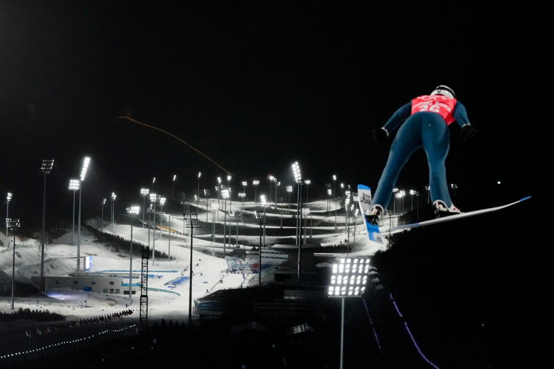 Mackenzie Boyd-Clowes, of Canada, jumps during a men's normal hill ski jumping training session at the 2022 Winter Olympics, Thursday, Feb. 3, 2022, in Zhangjiakou, China. (AP Photo/Andrew Medichini)