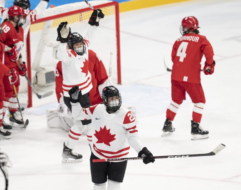 Canada forward Sarah Nurse (20), celebrates with teammate Brianne Jenner (19), rear, after scoring the first goal against the Russian Olympic Committee during first period women's ice hockey