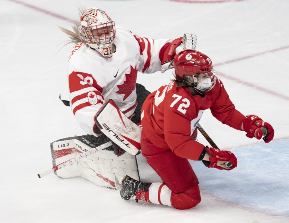 Russian Olympic Committee defender Anna Savonina (72) falls over Canada goalkeeper Emerance Maschmeyer