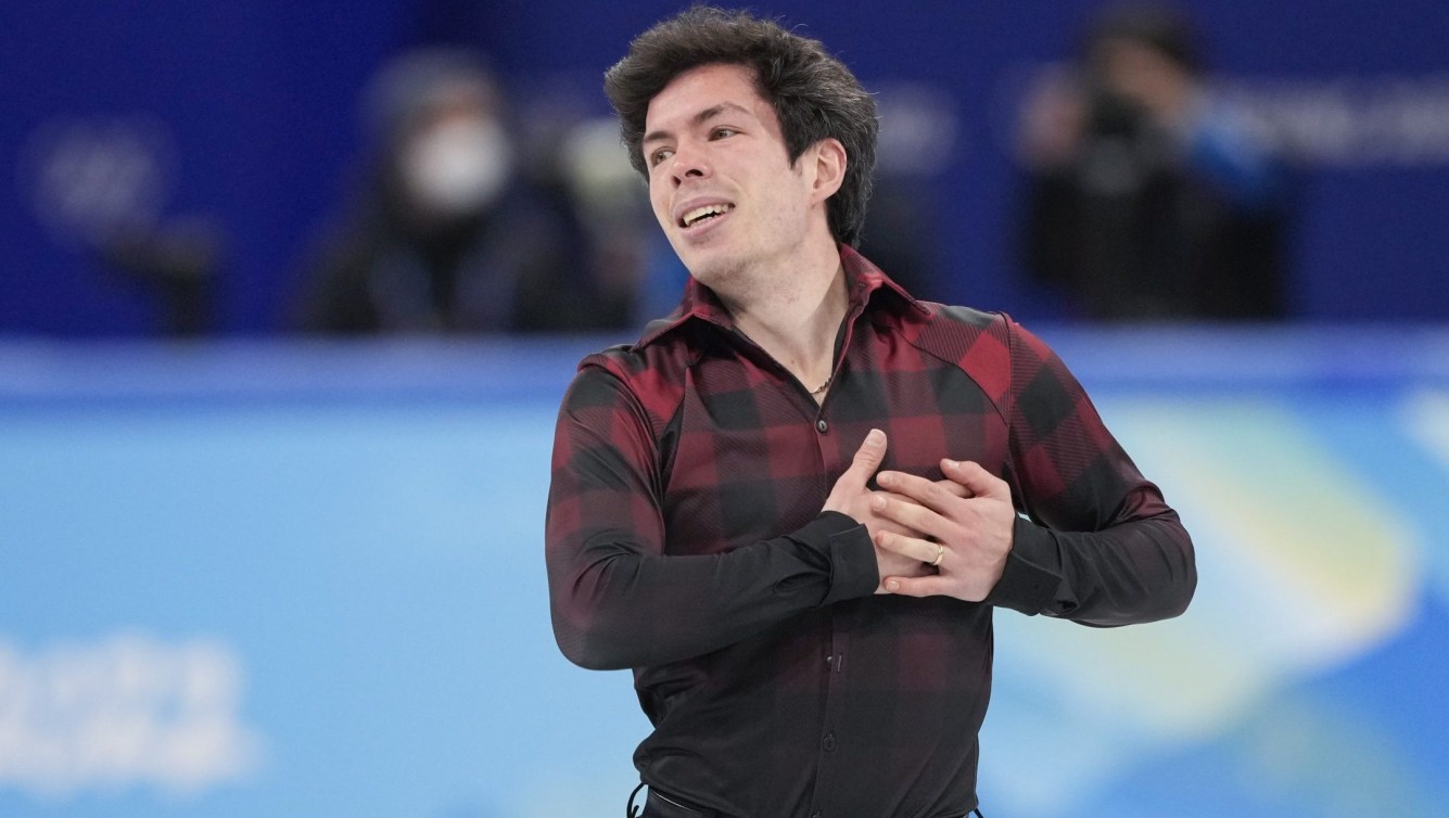 Keegan Messing smiles after his free skate program