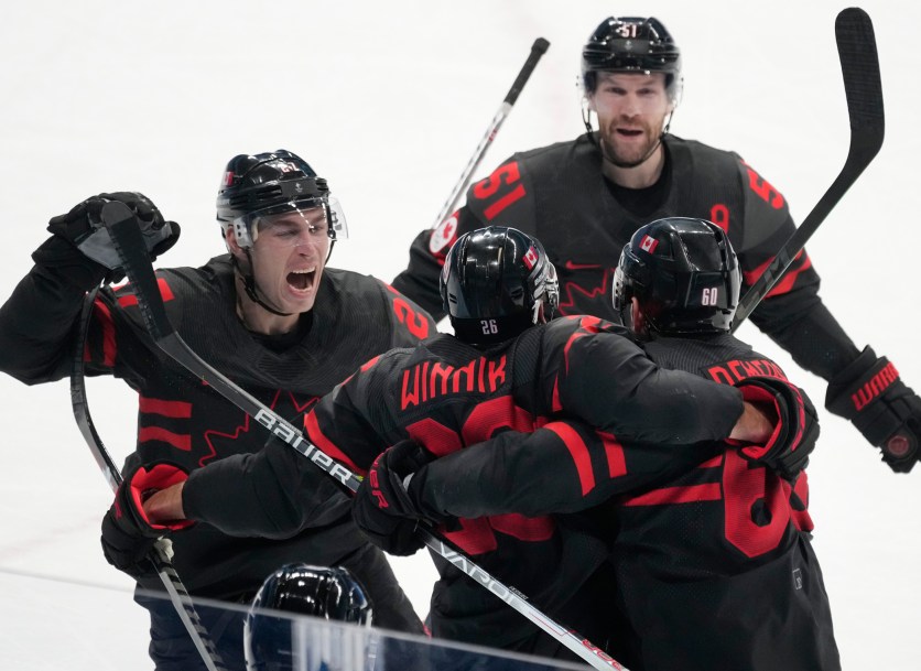 Team Canada forward Daniel Winnik (26) celebrates with teammates at Beijing 2022