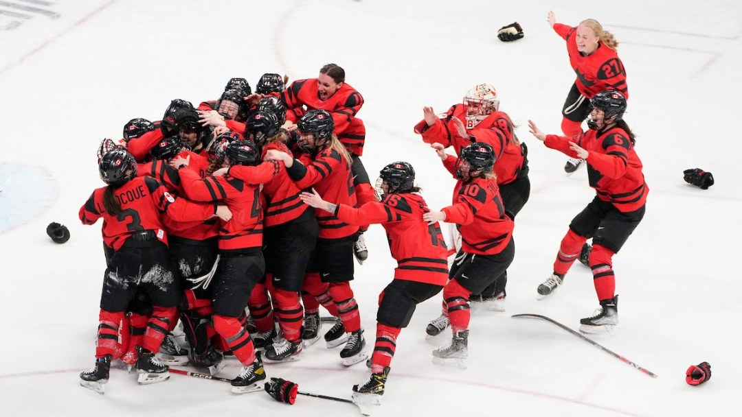 Team Canada's women's hockey team celebrates its gold medal win