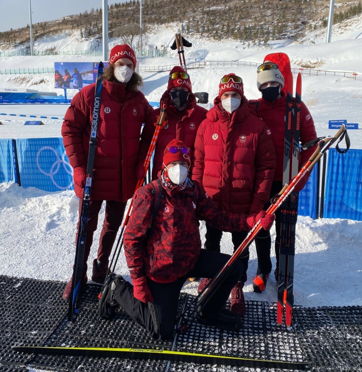 Canadian men's biathlon team posed with their skis 
