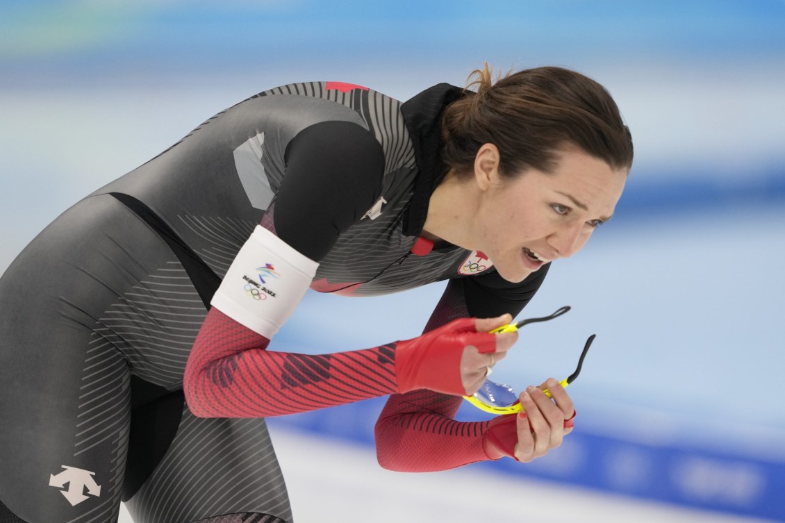 Isabelle Weidemann takes off her glasses after her speed skating race