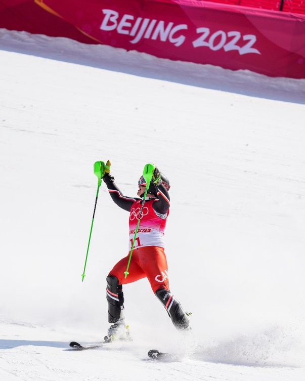 Jack Crawford raises his arms after seeing his time in the alpine combined