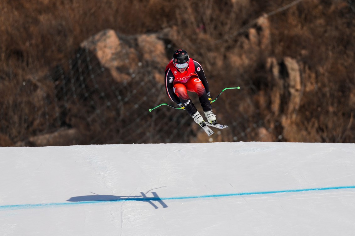 Jack Crawford comes over a jump in alpine skiing