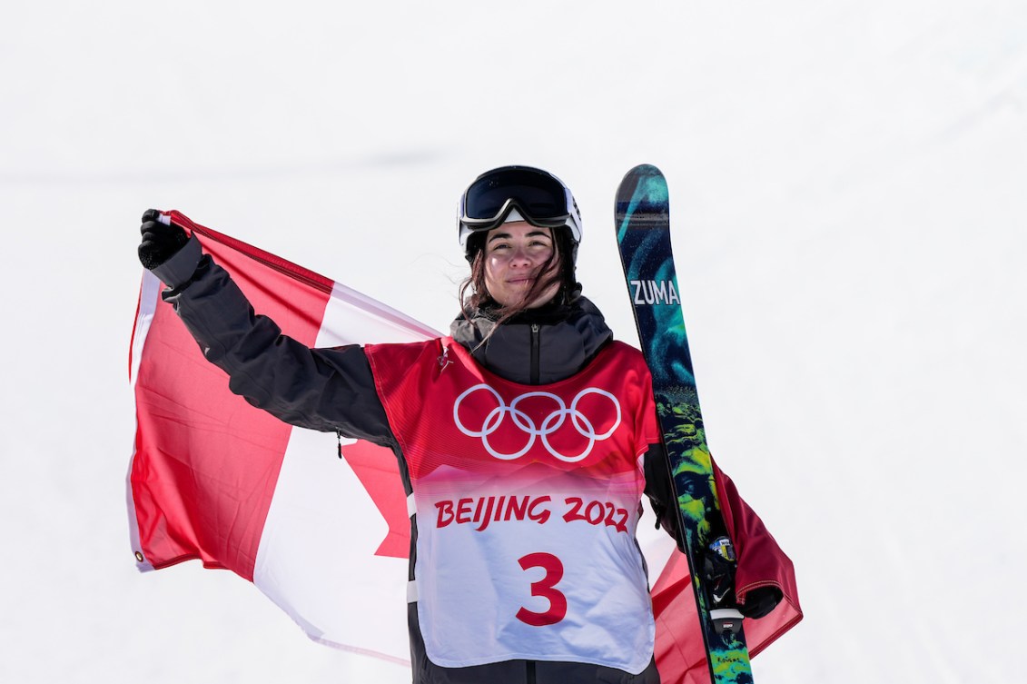 Rachael Karker holds up a Canadian flag