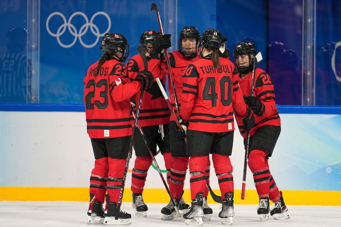 Brianne Jenner #19 of Team Canada celebrates a goal with teammates Erin Ambrose #23, Blayre Turnbull #40 and Sarah Nurse #20 against Team Finland