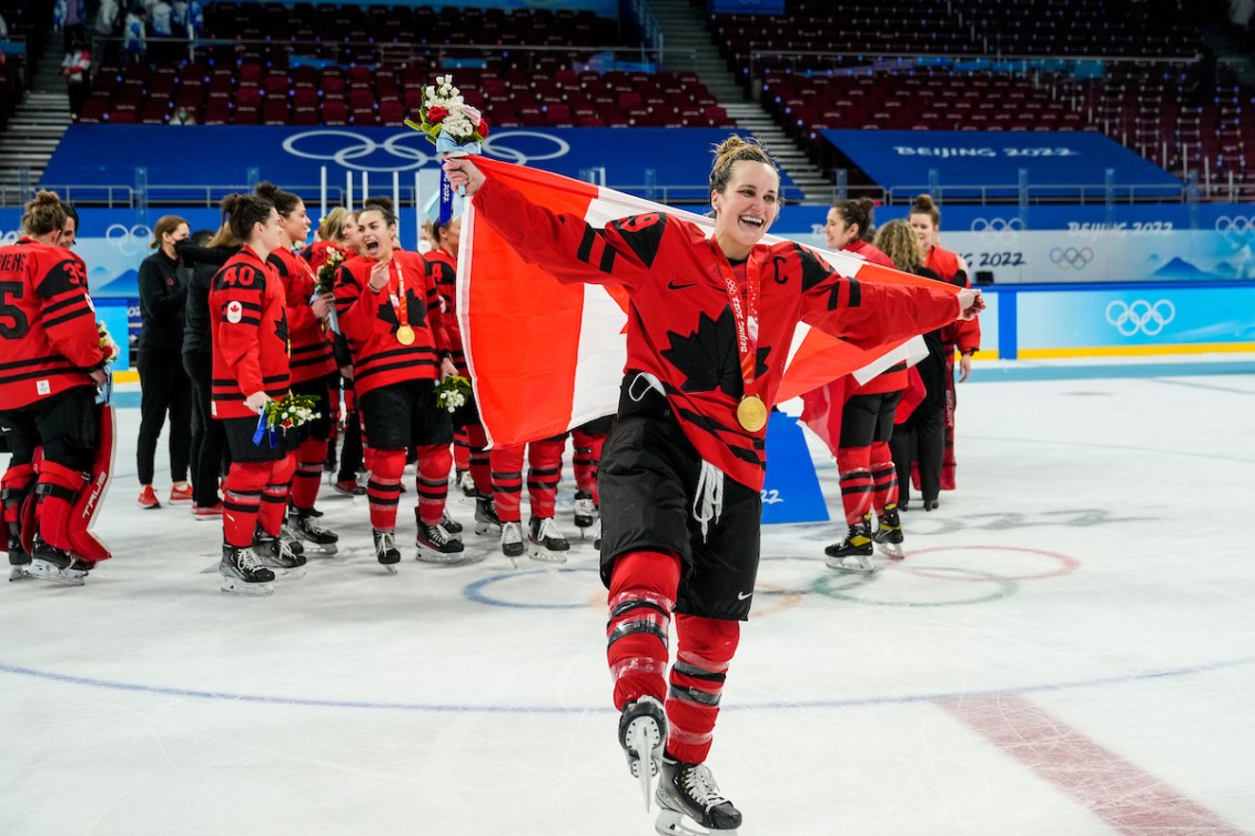 Marie-Philip Poulin and Team Canada celebrate winning women's hockey gold medal