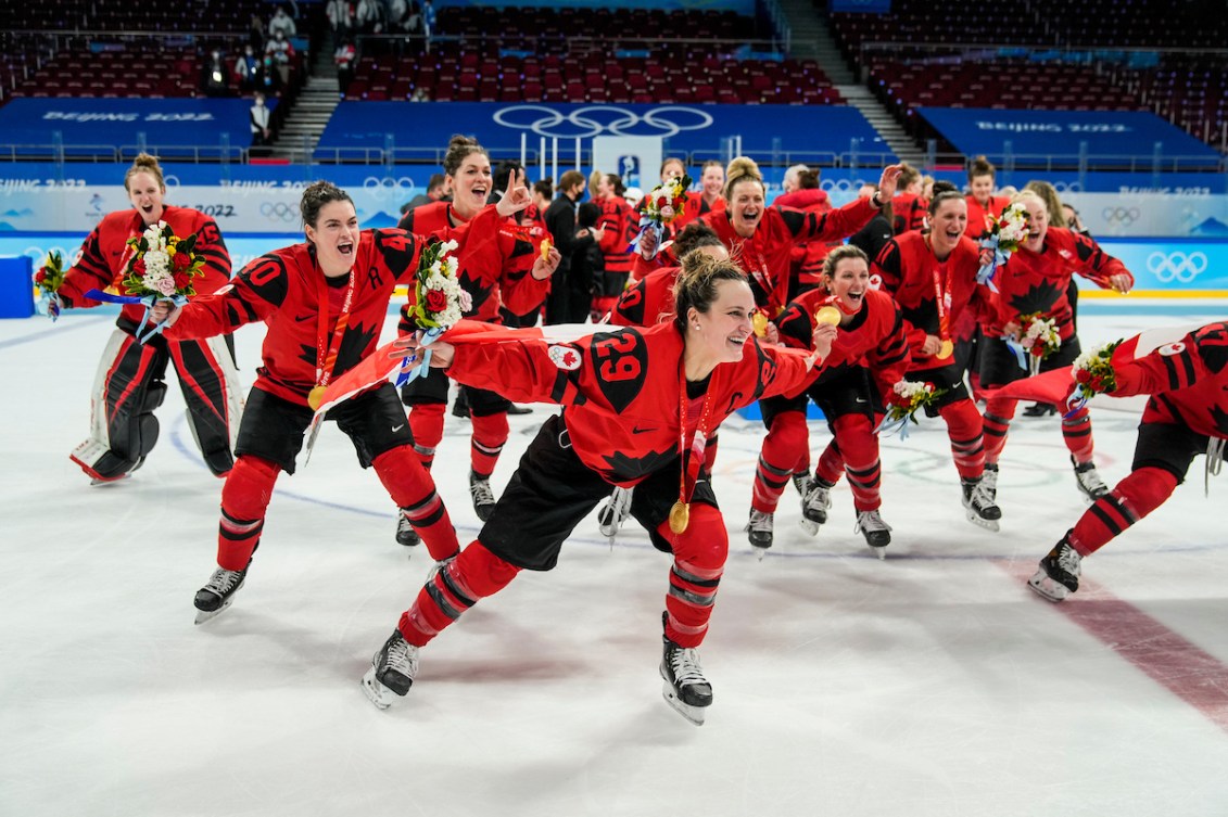 Marie-Philip Poulin and Team Canada celebrate winning women's hockey gold medal