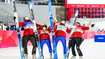 Four ski jumpers celebrate