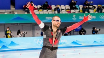 Team Canada long track speed skater Laurent Dubreuil celebrates after winning the silver medal