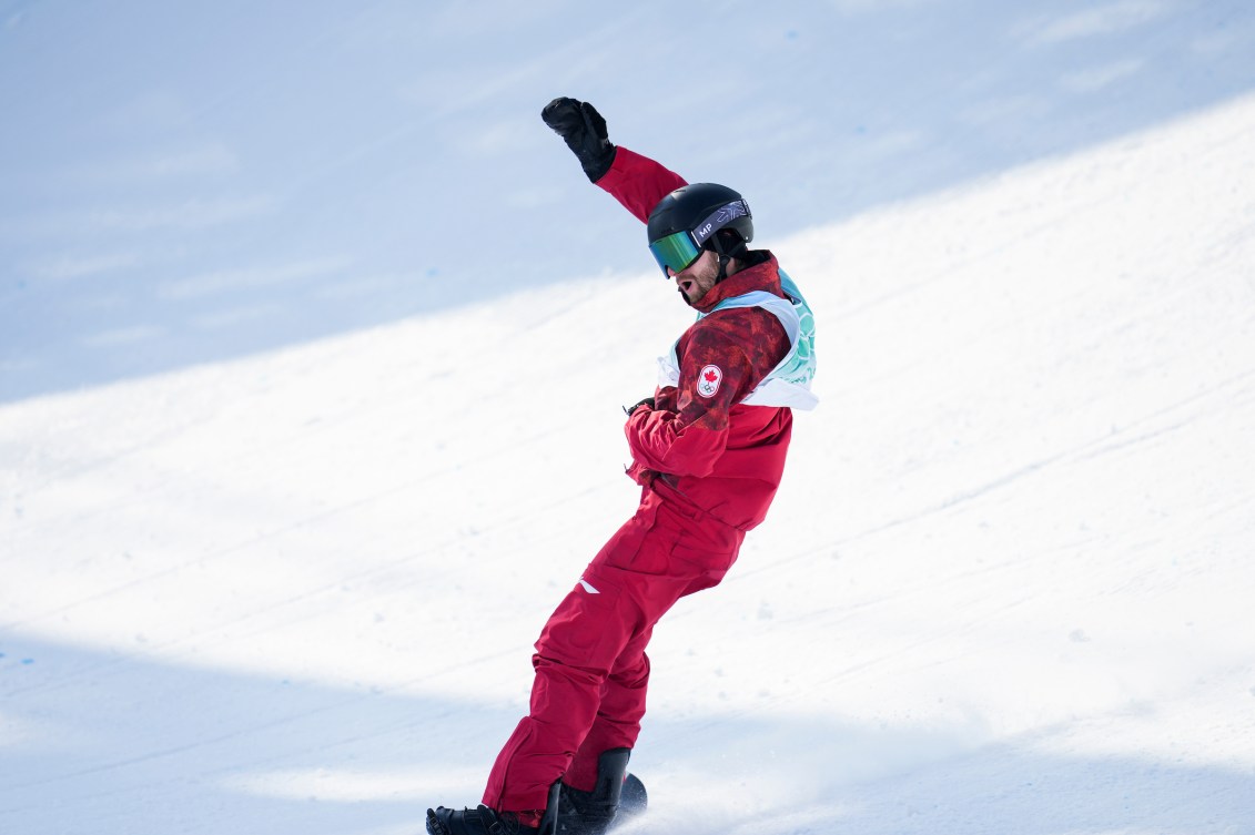 Max Parrot raises a fist after finishing a run 