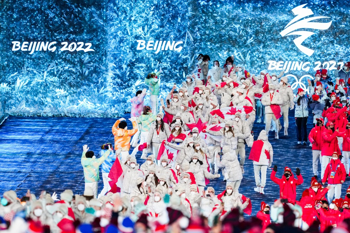 Team Canada athletes march into the closing ceremony