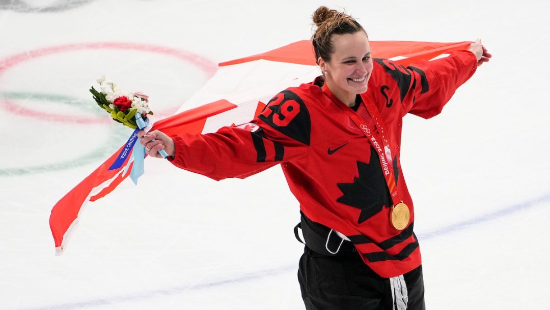 Marie-Philip Poulin and Team Canada celebrate winning women's hockey gold medal