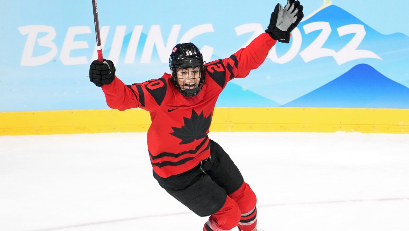 Sarah Nurse raises her arms to celebrate a goal