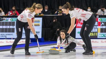 Kerri Einarson throws her stone which is ready to be swept by her teammates