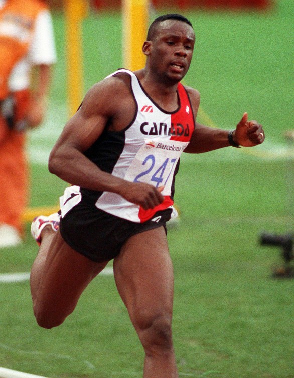 Bruny Surin running in a red and white singlet