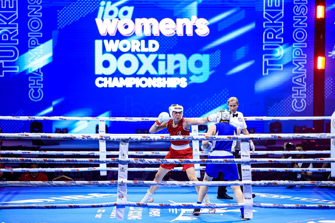 Wide shot of two female boxers in the ring