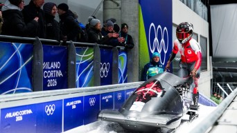 Cynthia Appiah arrives at the finish line in bobsleigh.
