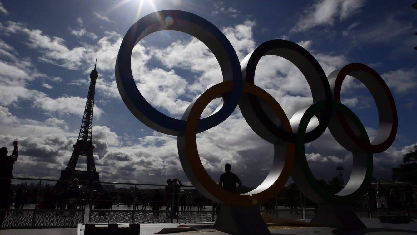 Eiffel Tower in the distance with Olympic rings in foreground