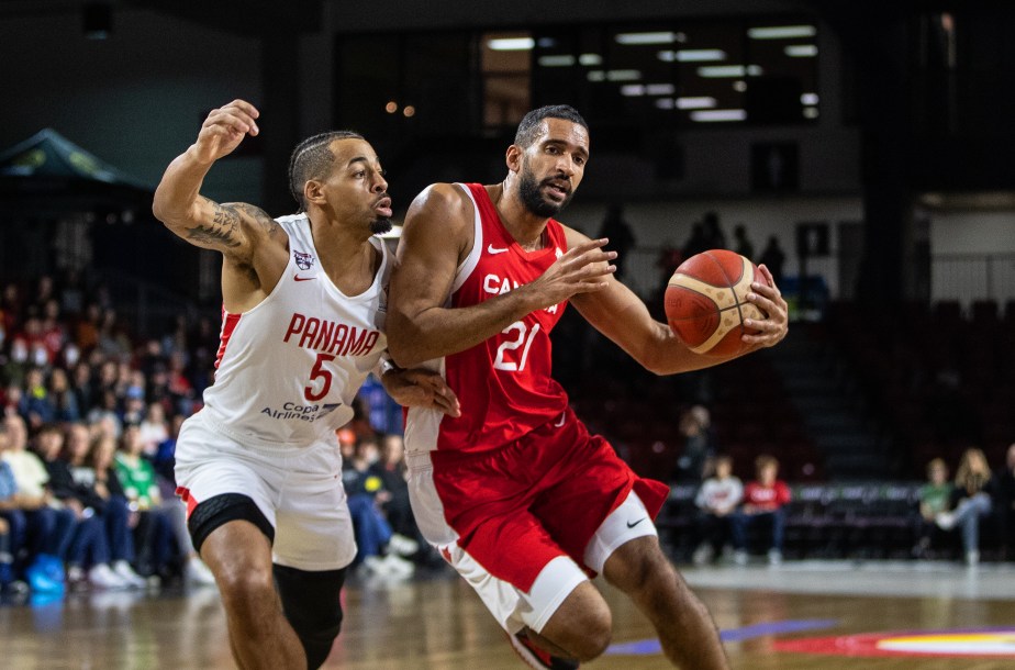 Canada's Thomas Scrubb drives to the hoop past an opponent