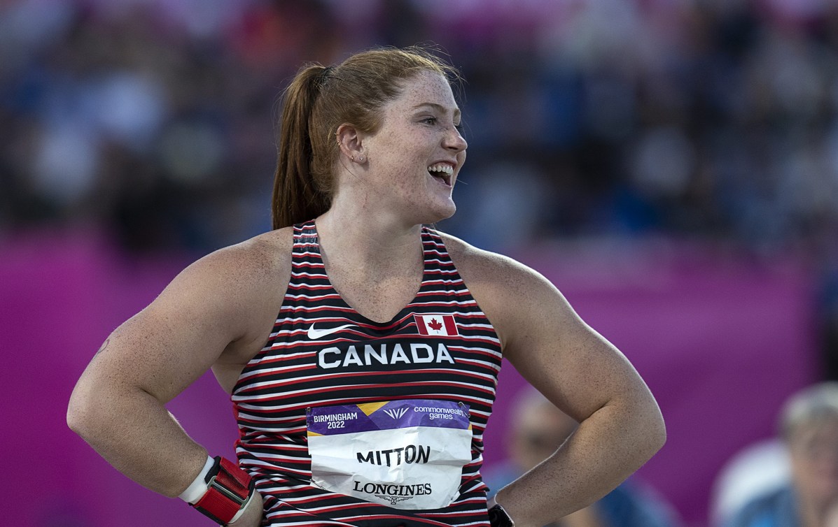 Canada's Sarah Mitton from from Brooklyn, N.S. reacts to a throw throws on the way to winning a gold medal in the shot put at the Commonwealth Games in Birmingham, England on Wednesday, Aug. 3, 2022