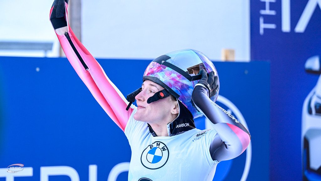 Mirela Rahneva waves to the crowd after a race