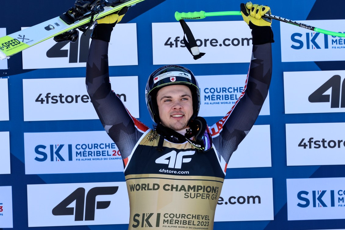 Jack Crawford wears a world champion bib on the podium 