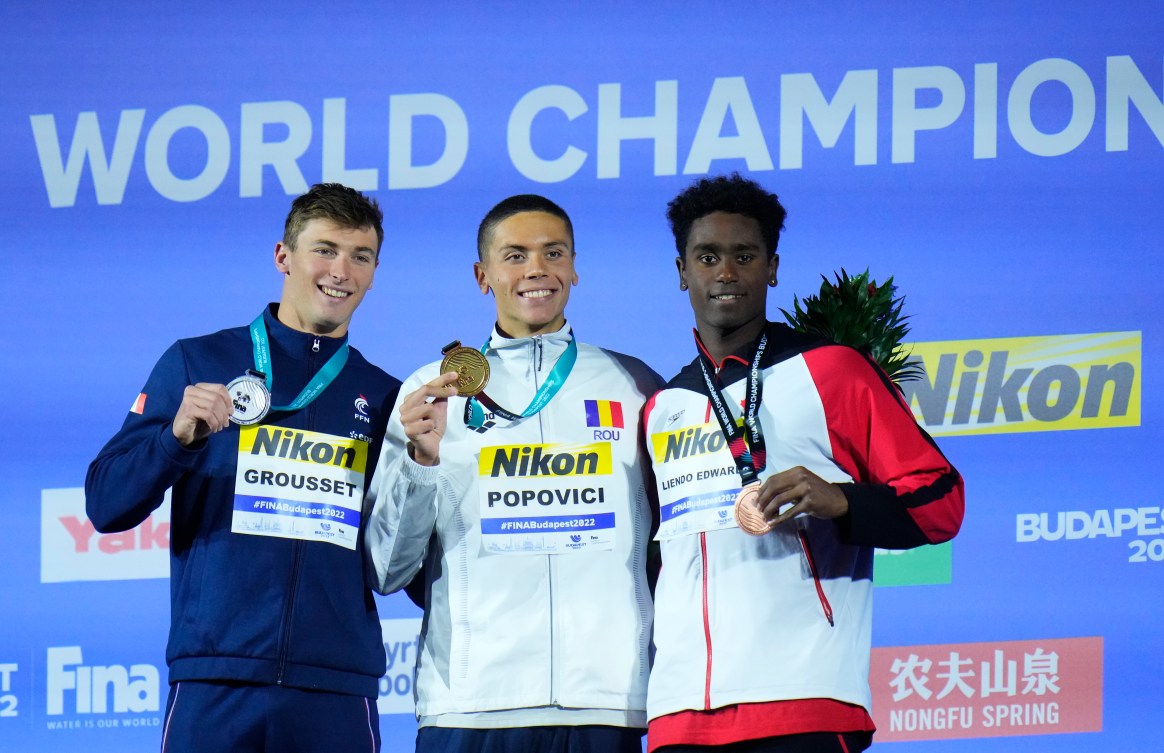 Joshua Liendo on the world championship podium with his fellow medallists