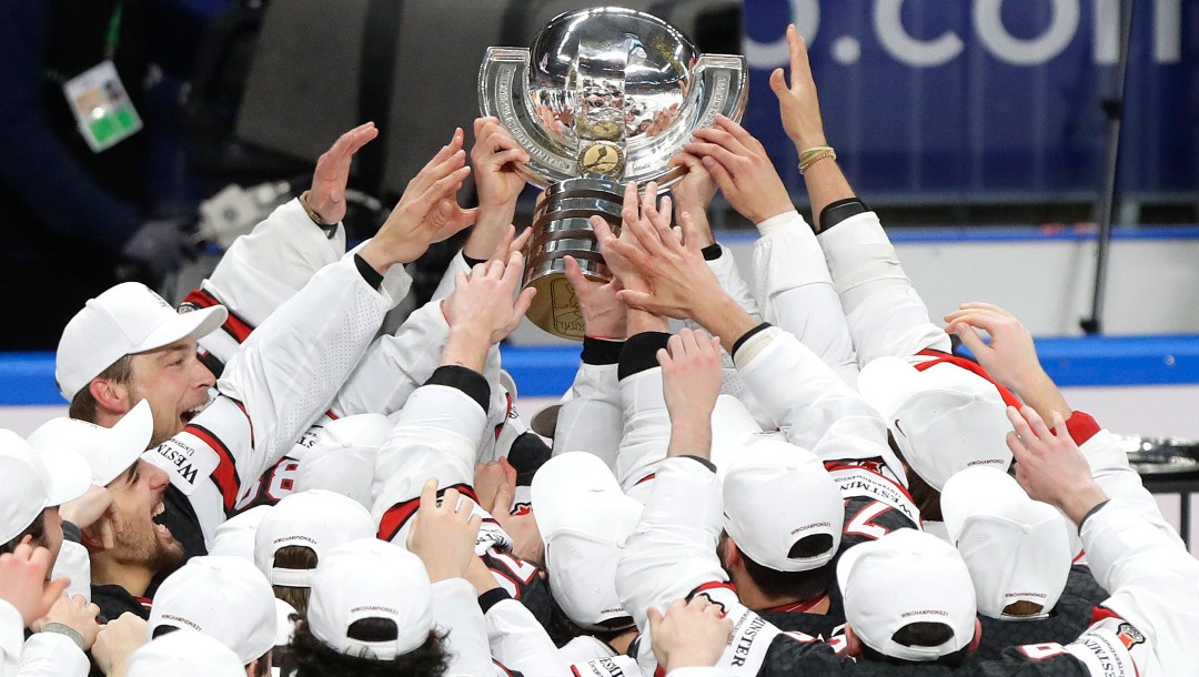 Team Canada players lift the trophy after winning the 2021 IIHF World Championship.