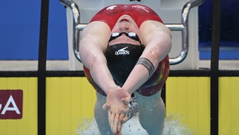 Ingrid Wilm of Canada starts in her heat of the women's 200m backstroke during the world swimming short course championships in Melbourne, Australia, Sunday, Dec. 18, 2022. (AP Photo/Asanka Brendon Ratnayake)