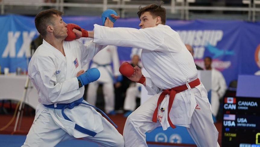 Ryan O'Neil punches his opponent in the face during a karate bout