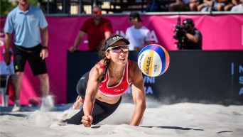 Pictured is Canadian beach volley ball player Melissa Humana-Paredes diving to play ball.