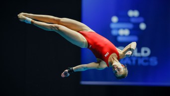 Caeli McKay dives off the 10m platform in layout position