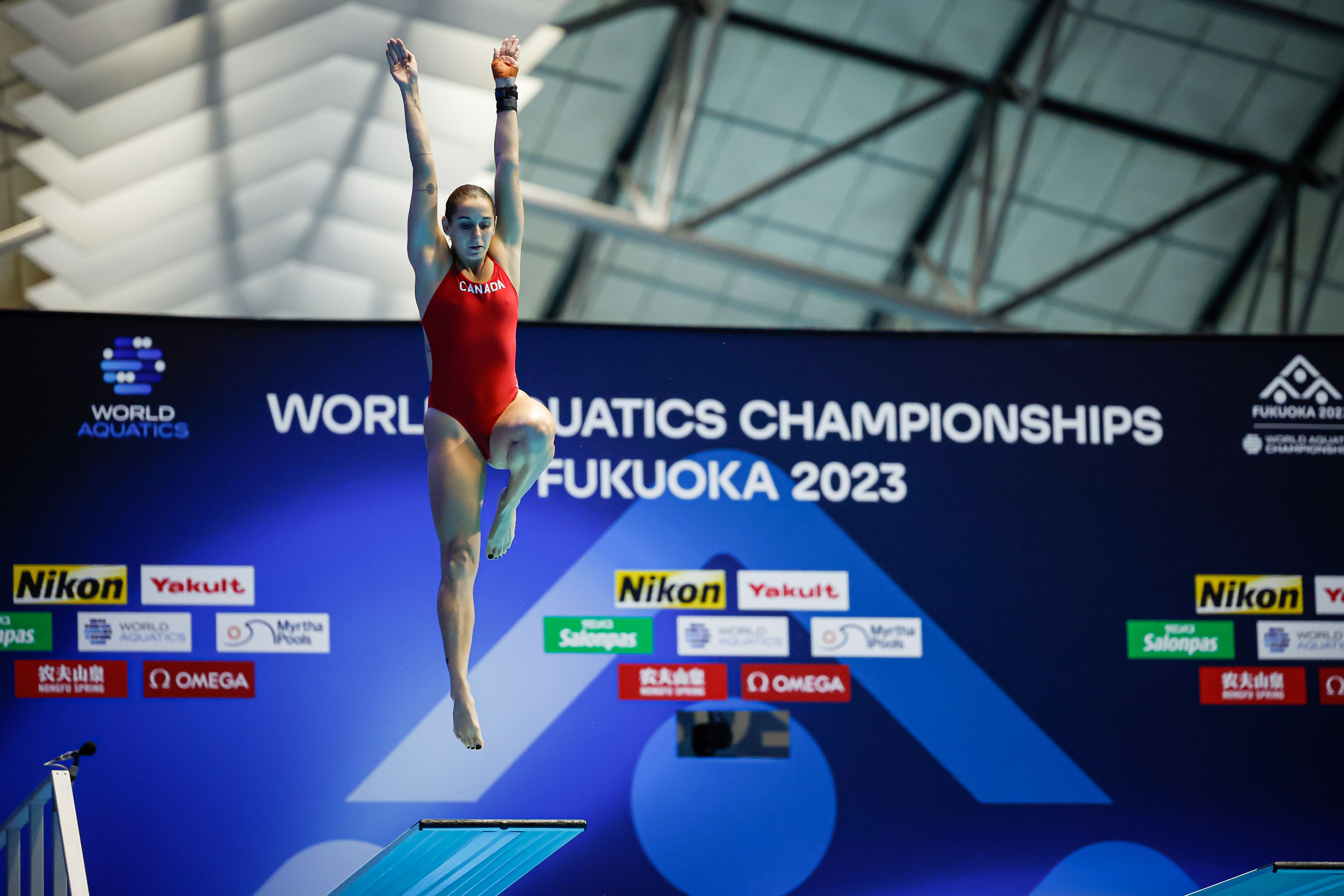 Pamela Ware bounces on the 3m springboard as she prepares to dive off 