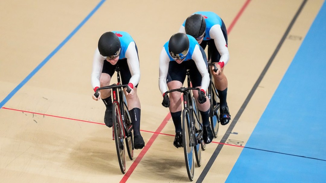 Jacklynn Boyle, Sarah Orban and Emy Savard ride their bikes at the velodrome