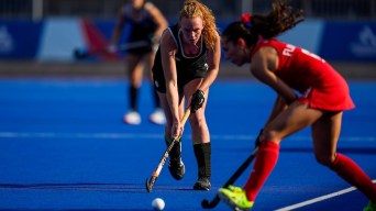 Chloe Walton has possession of the field hockey ball