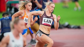 Madeline Price runs with the baton