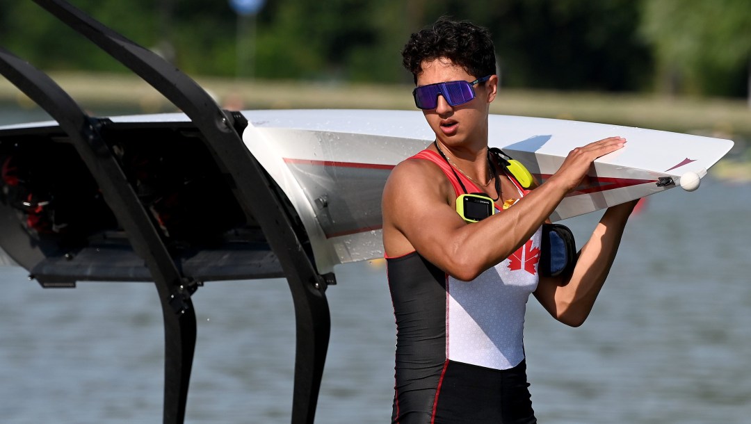 Michael Ciepiela carries his boat