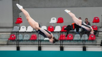 Rachel Tam and Gabriella Flynn are pictured in mid air