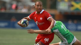 Elias Hancock fends off a tackle