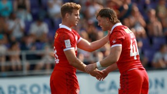 Jack Carson celebrates with teammate