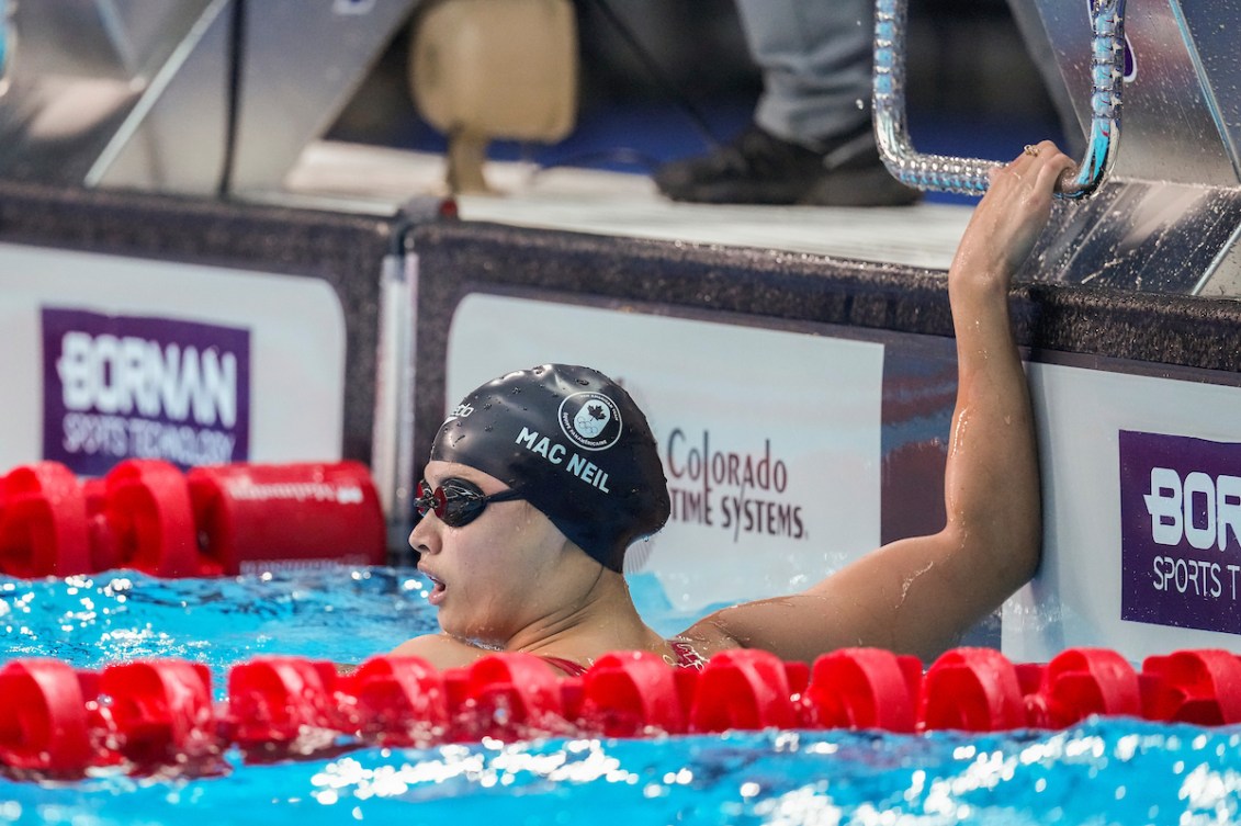 Maggie Mac Neil hangs onto the edge of the pool desk