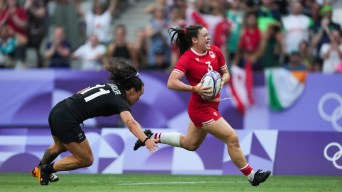 Alysha Corrigan carries the rugby ball