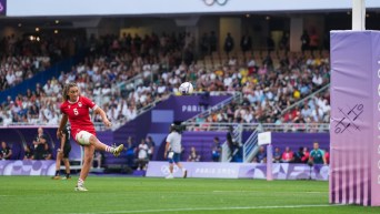 Chloe Daniels kicks the rugby ball